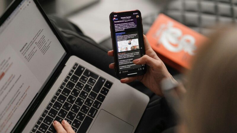 person holding black iphone 4